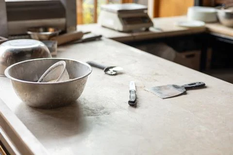 Tools and ingredients for baking bread displayed on a rustic tabletop in a cozy Stock Photos