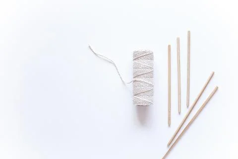 Tools and materials for macrame weaving over white surface. Cotton ropes and  Stock Photos