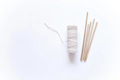 Tools and materials for macrame weaving over white surface. Cotton ropes and  Stock Photos