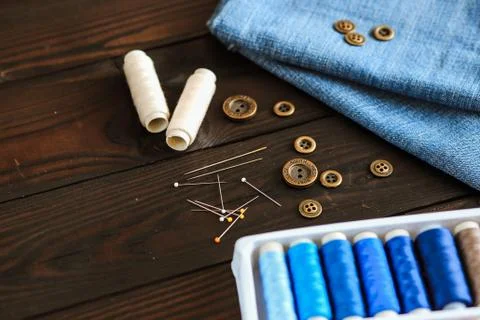 Tools and materials for sewing thread needles buttons Stock Photos