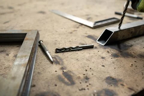 Tools and Materials Spread Across a Workbench with Metal Components for Cra.. Stock Photos