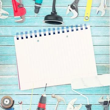 Tools and notepad on wooden background Stock Photos