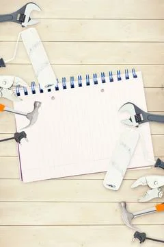 Tools and notepad on wooden background Stock Photos