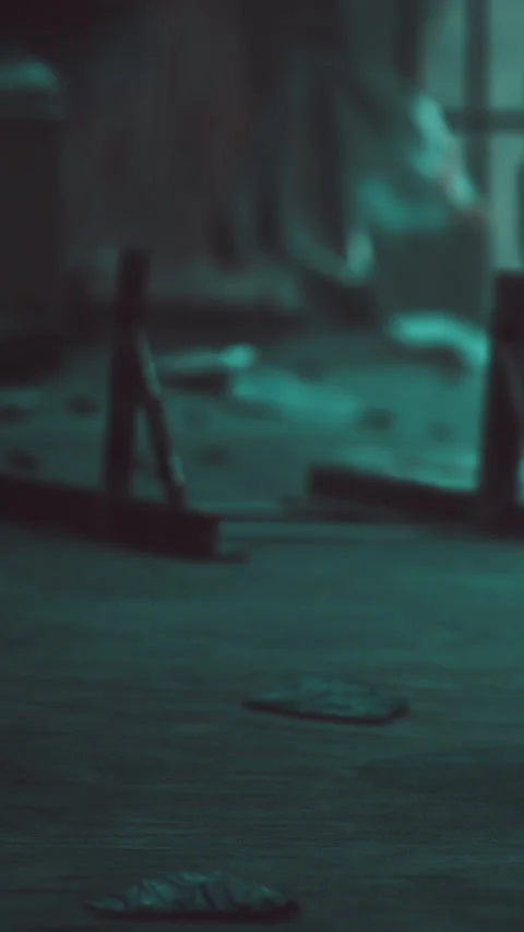 Tools and scattered items on a wooden surface in a dimly lit room Stock Footage 342202872