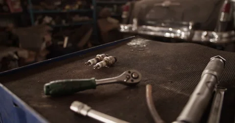 Tools and spark plugs on workbench Stock Footage 221107922