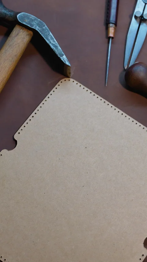 Tools and Templates for Leather Crafting on Brown Leather Stock Footage 296239130