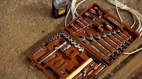 Tools and wires are lying on a concrete slab Stock Footage 170699177