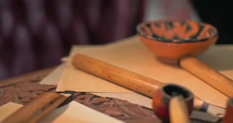 The tools of the Arabic caligraph are laid out on the table. Stock Footage 277873076