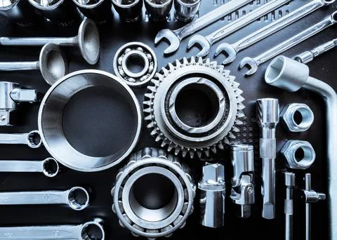 Tools arranged neatly on a dark surface showcasing a variety of mechanical Stock Photos