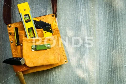 Tools in a bag for homework hang on a cipher board. Stock Photos