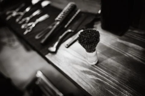 The tools of a Barber on the desktop in front of the mirror Stock Photos