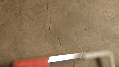 Tools being placed in frame on concrete Stock Footage 121008397