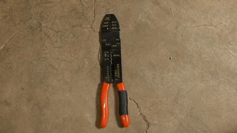 Tools being placed in frame on concrete Stock Footage 121008717