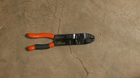 Tools being placed in frame on concrete Stock Footage 121008757