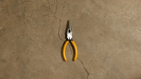 Tools being placed in frame on concrete Stock Footage 121008810