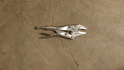 Tools being placed in frame on concrete Stock Footage 121009212
