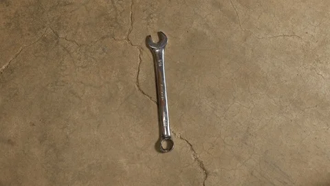 Tools being placed in frame on concrete Stock Footage 121009284