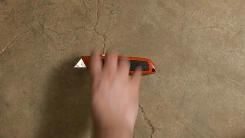 Tools being placed in frame on concrete Stock Footage 121009768