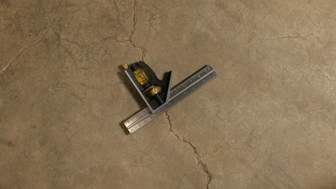 Tools being placed in frame on concrete Stock Footage 121009814