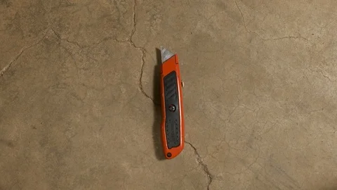 Tools being placed in frame on concrete Stock Footage 121010119