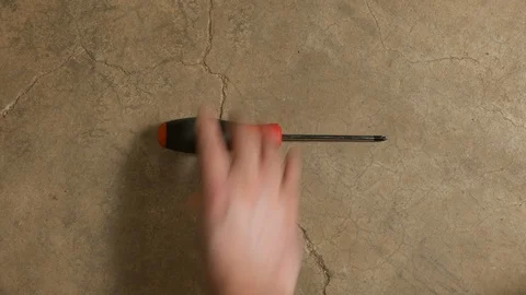 Tools being placed in frame on concrete Stock Footage 121010692