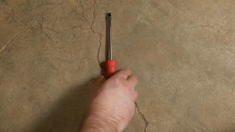 Tools being placed in frame on concrete Stock Footage 121010988