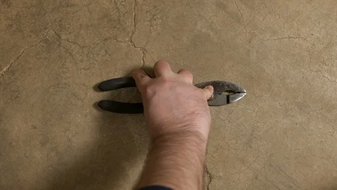 Tools being placed in frame on concrete Stock Footage 121011677