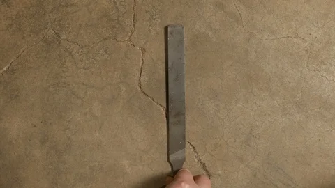 Tools being placed in frame on concrete Stock Footage 121011679