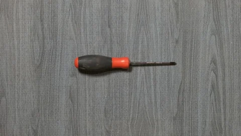 Tools being placed in frame by hand with grey wood texture backdrop Stock Footage 121007470