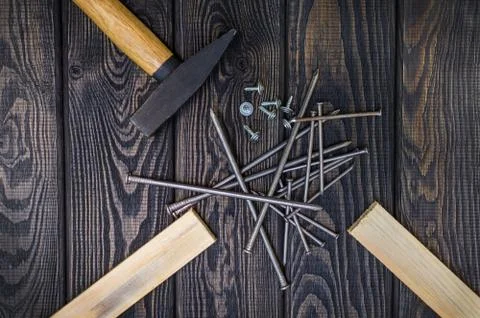 Tools for carpentry and accessories on a black wood background. Stock Photos