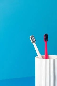 Tools for cleaning teeth stand in modern holder on counter. Copy space Stock-Fotos