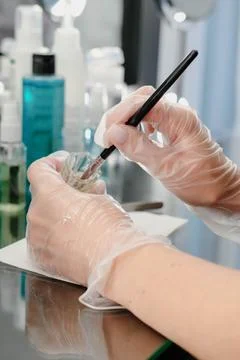 Tools for coloring and correction of eyebrows. Makeup artist stirs paint in.. 写真素材