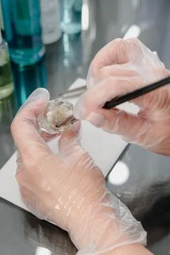 Tools for coloring and correction of eyebrows. Makeup artist stirs paint in.. 写真素材