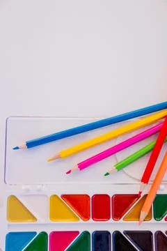 Tools for creative work on a white wooden background. Watercolor paintbox. Color Stock Photos