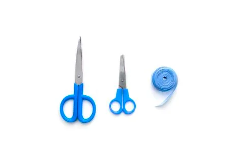 Tools for creativity scissors ribbon textile blue on white background Stock Photos