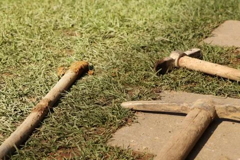 A tools for digging big hole in earth. Work around home. New thermal insulati Stock Photos