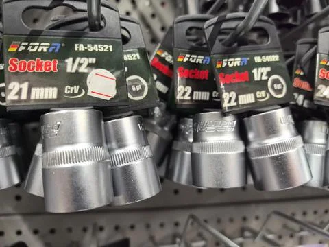 Tools displayed on a hardware store shelf showing various socket sizes Stock Photos