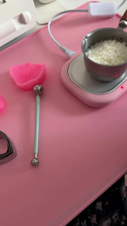 Tools for DIY candle making. Silicone mold for flower petals. Ladle with be.. Stock Footage 328313937