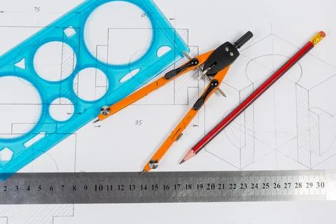 Tools for draftsmanship lie on a training drawing Stock Photos