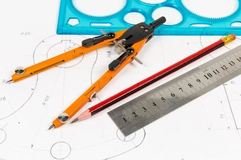 Tools for draftsmanship on a training drawing close-up Stock Photos