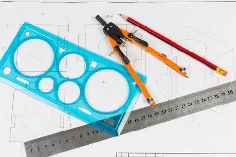 Tools for draftsmanship on a training drawing Stock Photos