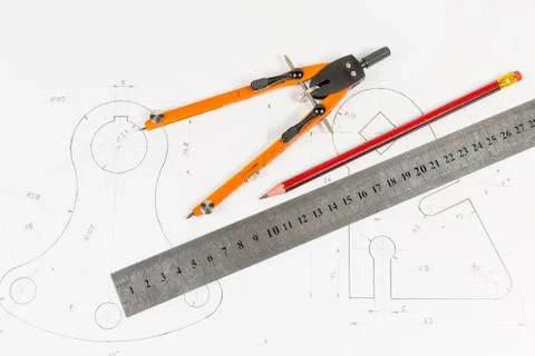 Tools for draftsmanship on a training drawing Stock Photos