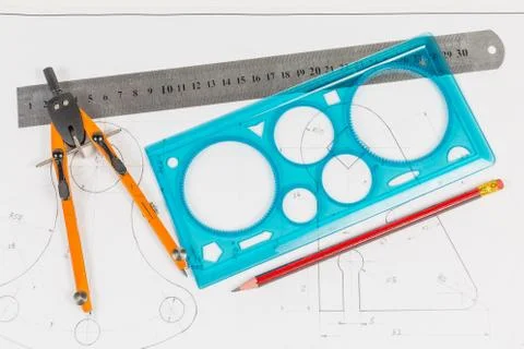 Tools for draftsmanship on a training drawing Stock Photos