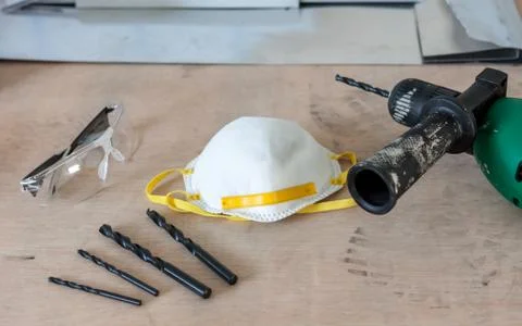 Tools drill and glasses in workshop Stock Photos
