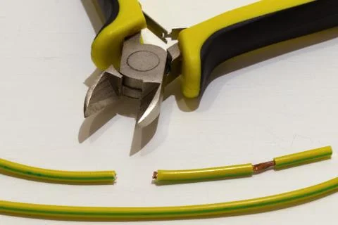 Tools for electrical work and the cut wires Stock Photos