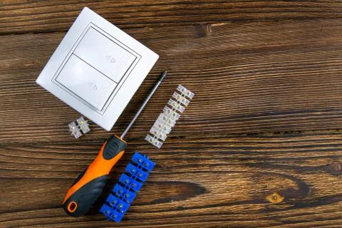 Tools of an electrician installer or Builder on a dark wooden table. The conc Foto stock