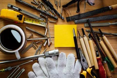 Tools equipment with coffee and notepad on wood Stock Photos