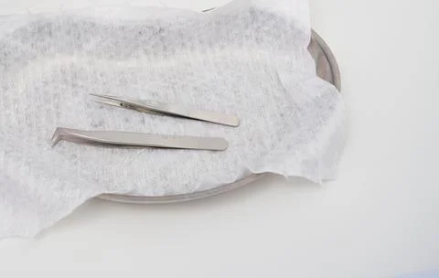 Tools for Eyelash Extension Procedure. Two sterile tweezers Stock Photos