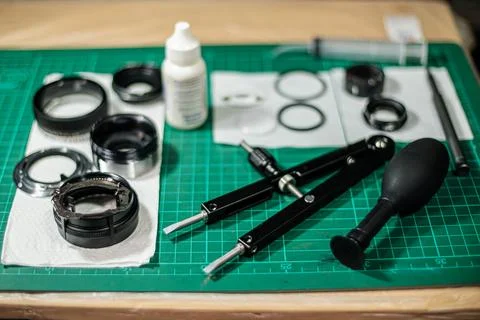 Tools for fixing and cleaning camera lens Stock-Fotos