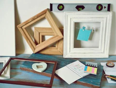 Tools, frame, notebook, congratulation on a wooden table, top view, father's day Stock Photos